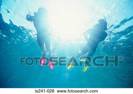 Scuba divers in sea View Large Photo Image Stock Photo - Scuba divers in sea. Fotosearch