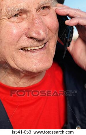 Elderly man smiling with cellphone View Large Photo Image Stock Image - Elderly man smiling with cellphone. Fotosearch