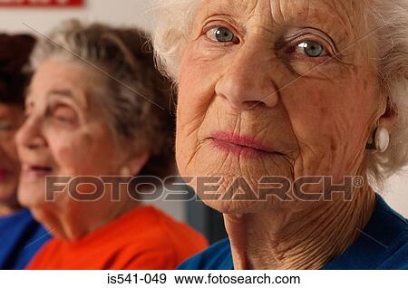 Portrait of elderly lady in foreground View Large Photo Image Stock Photo - Portrait of elderly lady in foreground. Fotosearch