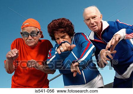 Three elderly people posing as youth View Large Photo Image Stock Photograph - Three elderly people posing as youth. Fotosearch