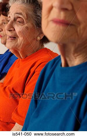 Stock Image - Three elderly women partial view. Fotosearch