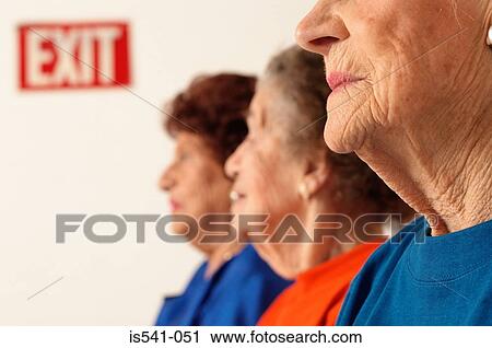 Stock Image - Three elderly women partial view. Fotosearch