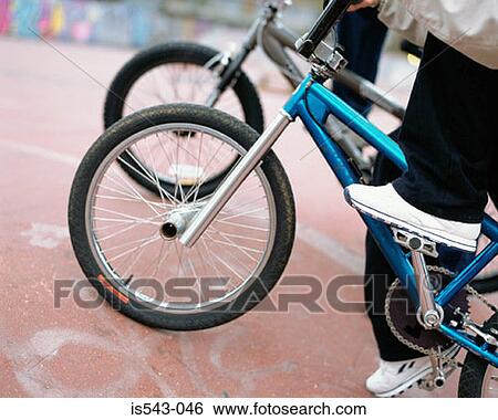 Boys riding BMX bicycles View Large Photo Image Stock Photograph - Boys riding BMX bicycles. Fotosearch
