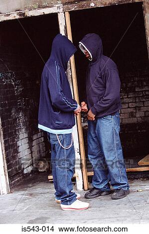 Picture - Boys sharing cigarettes. Fotosearch