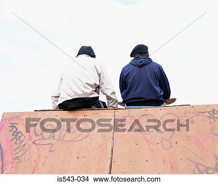 Boys sitting on ramp View Large Photo Image Picture - Boys sitting on ramp. Fotosearch