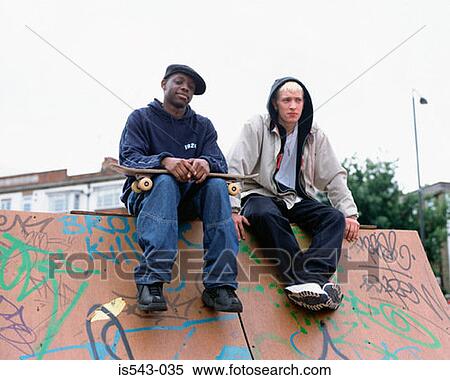 Boys sitting on skateboard ramp View Large Photo Image Stock Photography - Boys sitting on skateboard ramp. Fotosearch