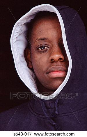 Stock Photo - Teenage boy wearing hooded jacket. Fotosearch
