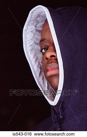 Stock Photograph - Teenage boy wearing hooded jacket. Fotosearch