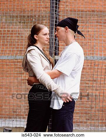 Teenage couple hugging View Large Photo Image Picture - Teenage couple hugging. Fotosearch