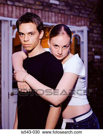 Teenage couple hugging View Large Photo Image Stock Image - Teenage couple hugging. Fotosearch