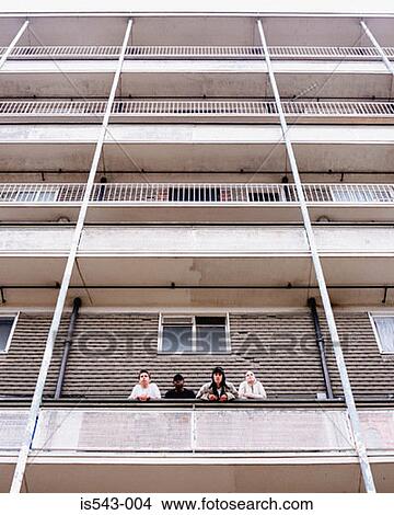 Picture - Teenagers standing on balcony. Fotosearch