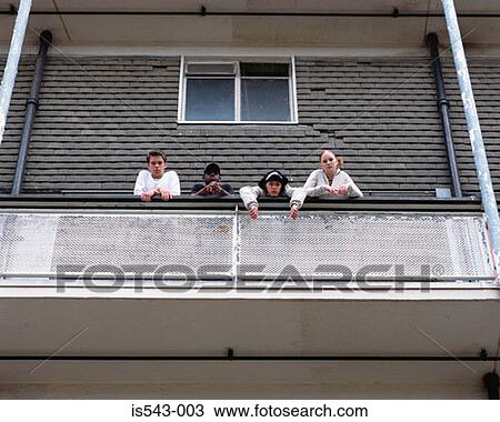 Teenagers standing on balcony View Large Photo Image Stock Image - Teenagers standing on balcony. Fotosearch