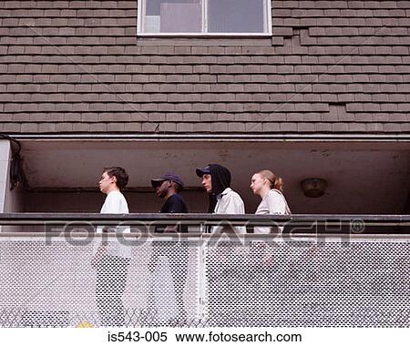 Teenagers standing on balcony View Large Photo Image Stock Photography - Teenagers standing on balcony. Fotosearch
