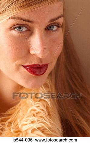 Stock Photograph - Portrait of blonde looking to camera. Fotosearch