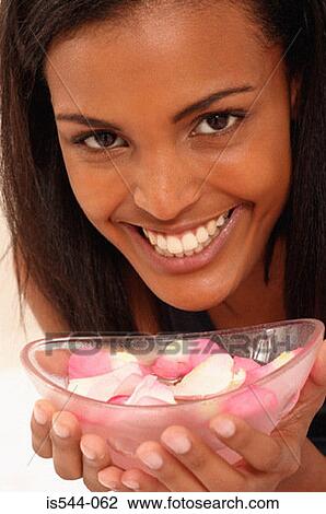 Smiling young woman with bowl View Large Photo Image Stock Image - Smiling young woman with bowl. Fotosearch