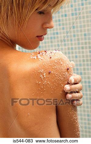 Young woman exfoliating arm View Large Photo Image Stock Image - Young woman exfoliating arm. Fotosearch