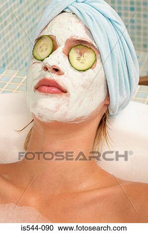 Young woman having facial in bath View Large Photo Image Stock Image - Young woman having facial in bath. Fotosearch
