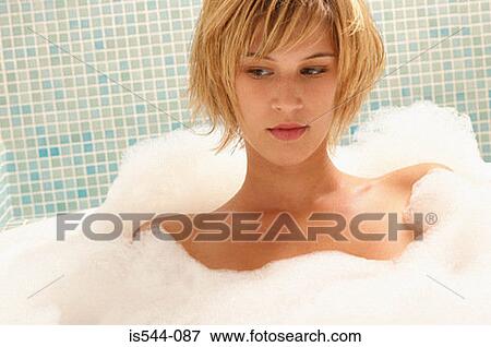 Young woman in bubble bath View Large Photo Image Stock Photo - Young woman in bubble bath. Fotosearch
