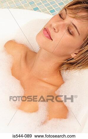 Young woman relaxing in bubble bath View Large Photo Image Stock Photo - Young woman relaxing in bubble bath. Fotosearch