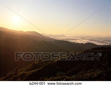 Sun behind mountain View Large Photo Image Stock Image - Sun behind mountain. Fotosearch