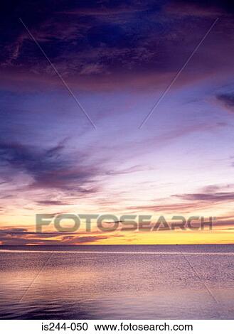 Sunset over water View Large Photo Image Stock Image - Sunset over water. Fotosearch