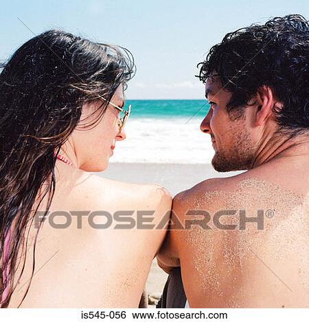 beach, blue sky, couple, eye contact, holiday View Large Photo Image Stock Photograph - beach, blue sky, couple, eye contact, holiday. Fotosearch