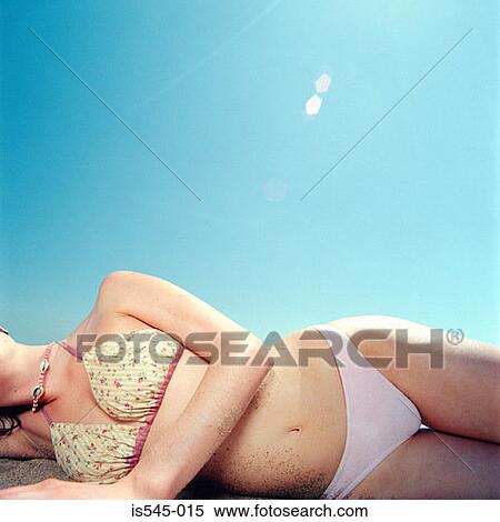 bikini, blue sky, holiday, lying down, sand View Large Photo Image Stock Photography - bikini, blue sky, holiday, lying down, sand. Fotosearch