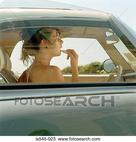 Stock Image - car, holiday, lipstick, make-up, summer. Fotosearch