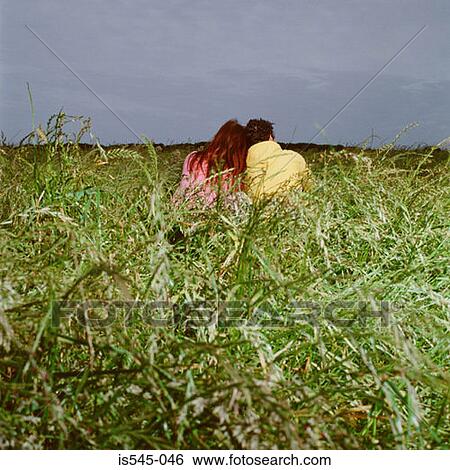 cloudy, couple, field, grass, holiday View Large Photo Image Stock Photograph - cloudy, couple, field, grass, holiday. Fotosearch