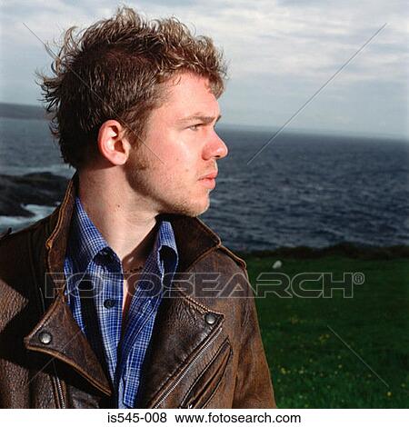 Stock Photo - cloudy, horizon, leather jacket, overcast. Fotosearch