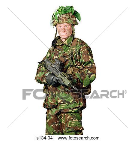 Stock Image - camouflage, Caucasian, gun, helmet, holding. Fotosearch