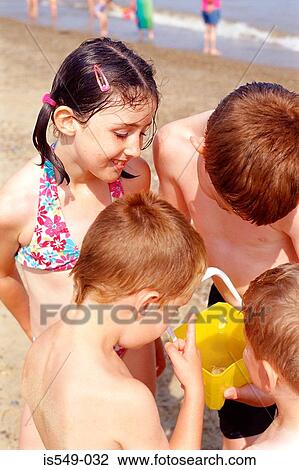 Children playing on the beach View Large Photo Image Stock Image - Children playing on the beach. Fotosearch