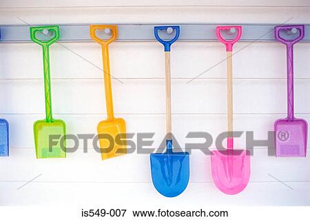 Colourful beach spades View Large Photo Image Stock Photo - Colourful beach spades. Fotosearch