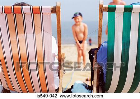 Deck chairs on the beach View Large Photo Image Stock Image - Deck chairs on the beach. Fotosearch
