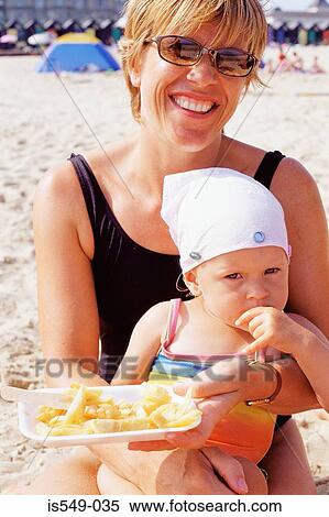 Fish and chips on the beach View Large Photo Image Stock Photography - Fish and chips on the beach. Fotosearch