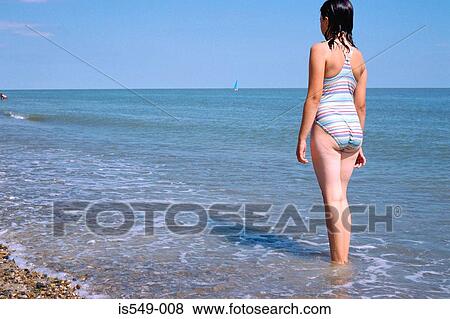 Girl standing in the sea View Large Photo Image Stock Photo - Girl standing in the sea. Fotosearch