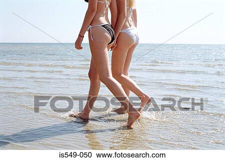 Stock Image - Girls on the beach. Fotosearch