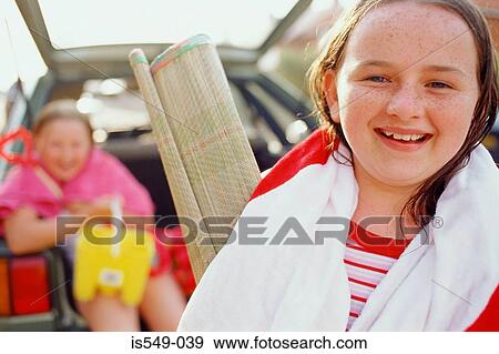 Happy girl with beach straw mat View Large Photo Image Stock Photo - Happy girl with beach straw mat. Fotosearch