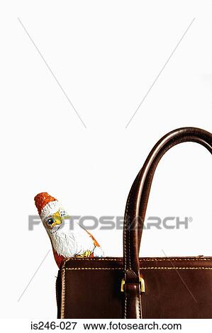 Stock Photo - Chocolate Santa Claus in handbag. Fotosearch