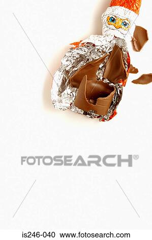 Stock Image - Santa Claus chocolate in wrapper. Fotosearch