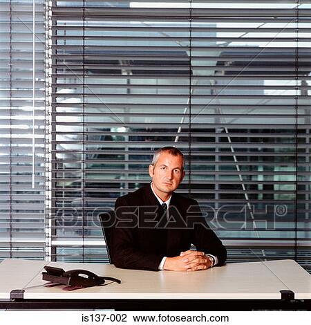 Stock Image - Businessman at work. Fotosearch