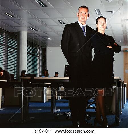 Businesswoman and businessman at work View Large Photo Image Stock Image - Businesswoman and businessman at work. Fotosearch