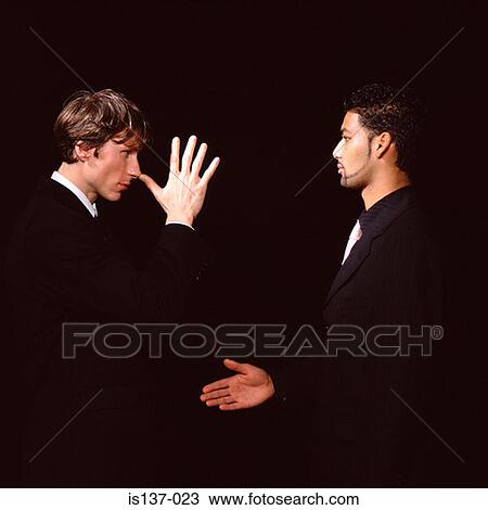 Stock Image - Jokey handshake. Fotosearch