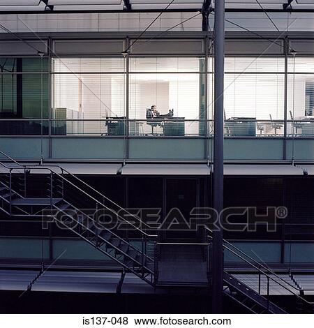 Working at a quiet office View Large Photo Image Stock Photo - Working at a quiet office. Fotosearch