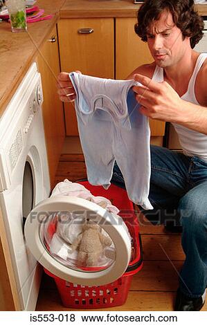 Stock Photo - Father with laundry basket. Fotosearch