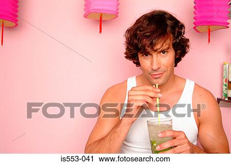 Man at home with drink View Large Photo Image Stock Image - Man at home with drink. Fotosearch