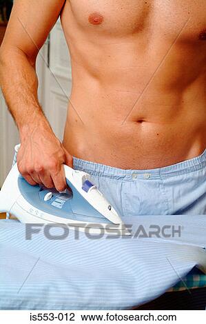 Man ironing shirt View Large Photo Image Stock Image - Man ironing shirt. Fotosearch