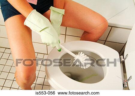 Woman cleaning toilet bowl View Large Photo Image Stock Photograph - Woman cleaning toilet bowl. Fotosearch