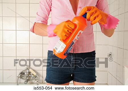 Picture - Woman with cleaning liquid. Fotosearch