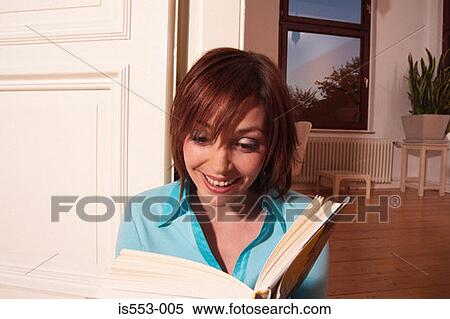 Young woman enjoying book View Large Photo Image Stock Photography - Young woman enjoying book. Fotosearch